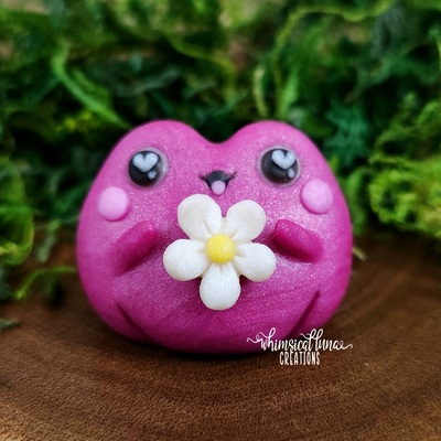 Pink frog w/white flower