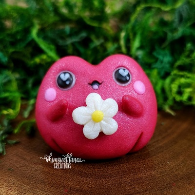 Red frog w/white flower