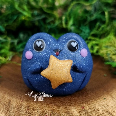 Glittery blue frog w/gold star