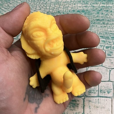 Horny monster - (unpainted green rubber with solid black felt vest)
