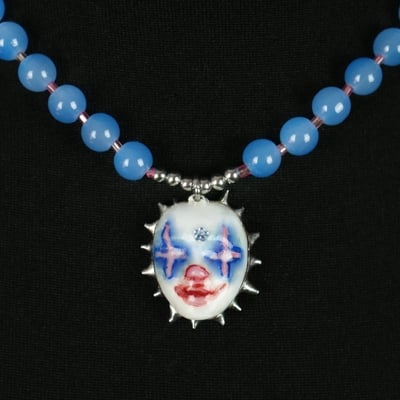 Handmade blue clown doll face necklace