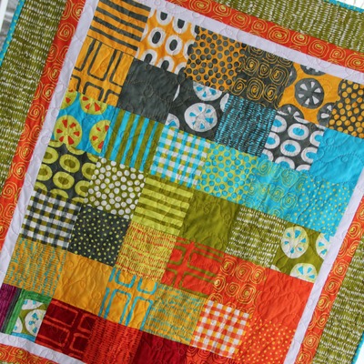 A stitch in color baby/toddler quilt