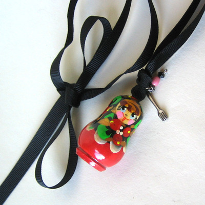 Rescued red matroyshka necklace on black grosgrain