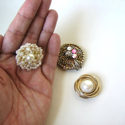 Orphan vintage earring magnets in a sweet tin