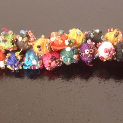 Deep red thread work pom pom bracelet