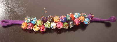 Purple thread pom pom bracelet