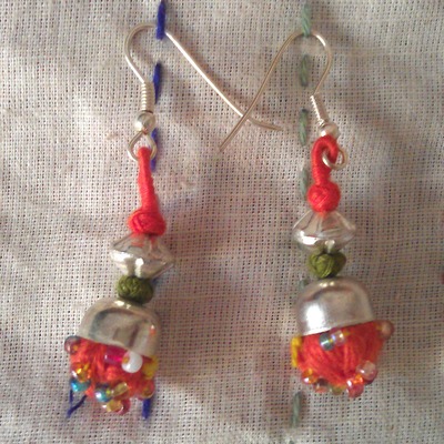 100 percent hand-made orange pom pom thread work earrings