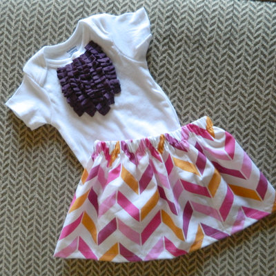 Plum ruffle bib onesie