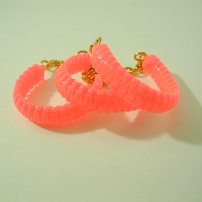 Mini cobra knot bangle - neon pink (clear)