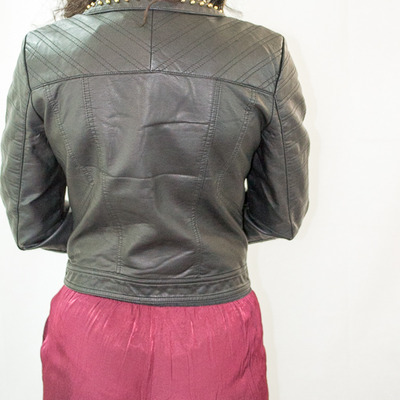 Black faux leather jacket with gold studs