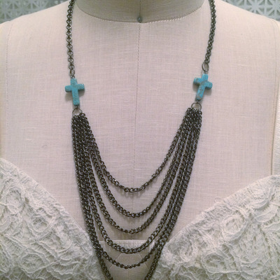 Draping crosses necklace