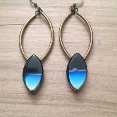 Eye of the peacock earrings in ant gold