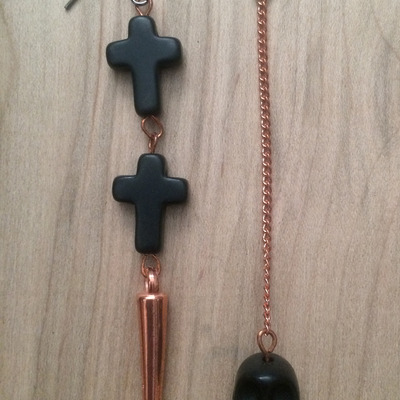 Asymmetrical skull cross earrings