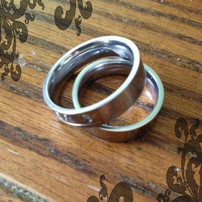 His and hers stainless steel promise rings / 9w and 12m