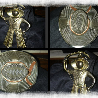Vintage gold tone cowboy and lasso pin