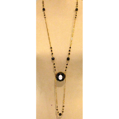 Gold chain with black beading and a cameo accent*