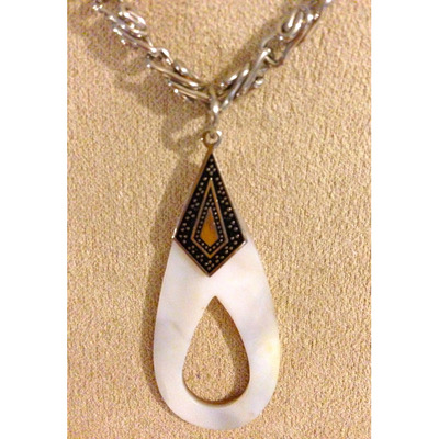 Silver chain with white oval pendant