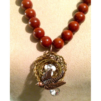 Brown Beading with Bird Nest Pendant*