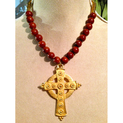 Burnt orange beads and cross pendant
