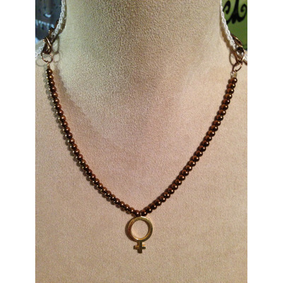Brassy beads with the female pendant