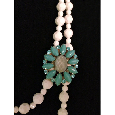 White Beading with a Sparkly Blue Brooch