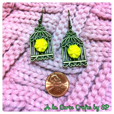 {earrings} bird cage with yellow cab flower