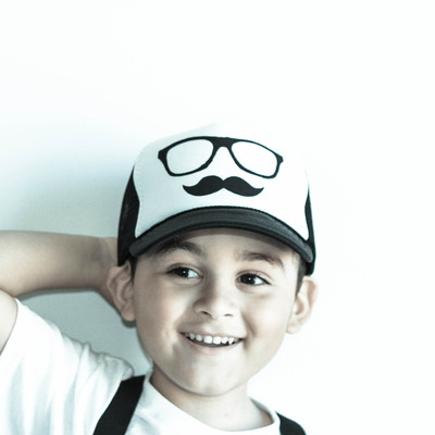 The mr. hudson mustache logo trucker hat