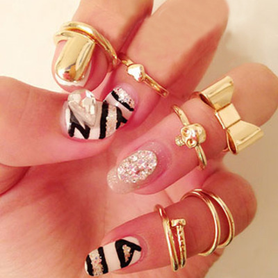 7pcs set of rings includes skull, bowknot, heart, and others 