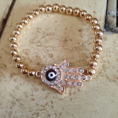 Gold tone hamsa bracelet
