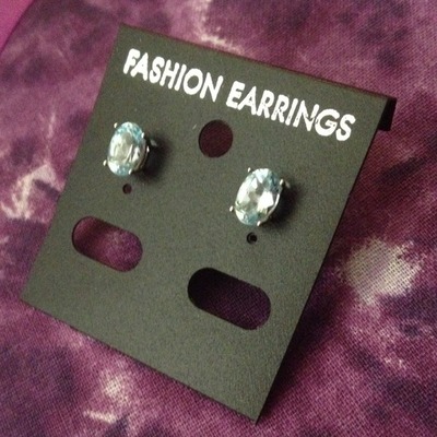 Light blue or Mystic oval shape earrings. Size: OS