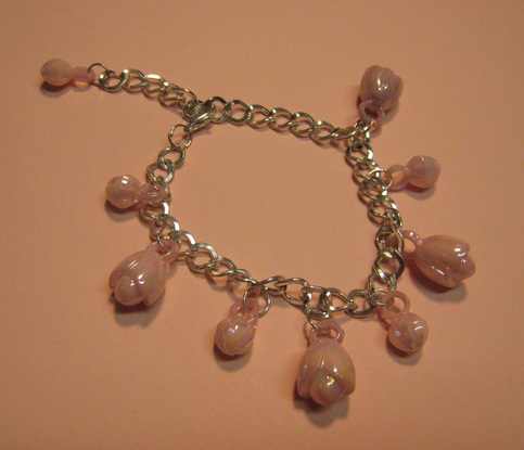 Metal & Pink Plastic Charm Bracelet