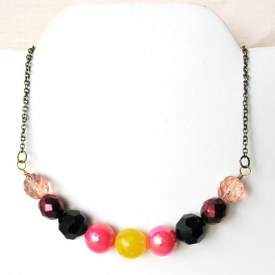 Handmade beaded necklace. mod inspired colorful beaded necklace. pink black yellow mix.  lovey sweet