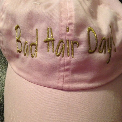 Bad hair day!  baseball cap