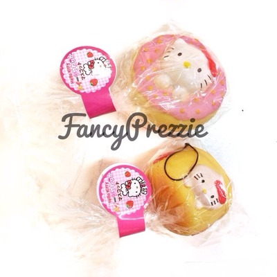 Hello kitty in a cream puff / donut suit squishy