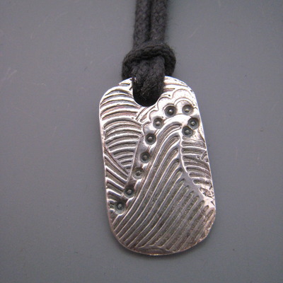 Mavericks tag l, 1 wave, on cord