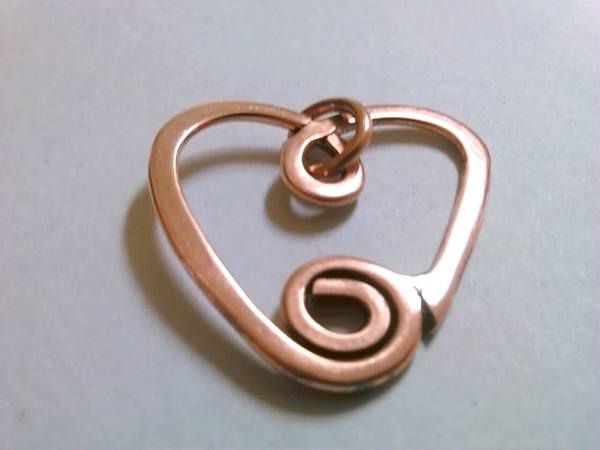 Hand hammered copper swirly heart pendant