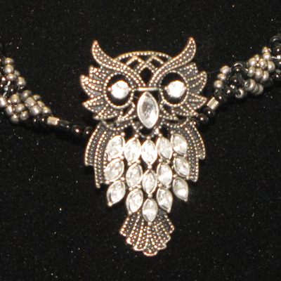 Hand woven glass beaded spiral rope with owl - 17 inches.