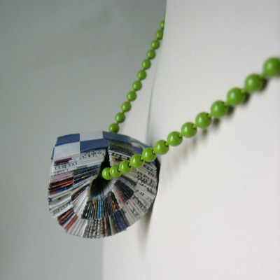 Upcycled paper pendant on green ball chain