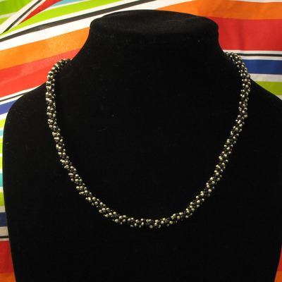 Hand woven glass beaded spiral rope - black and metallic green 