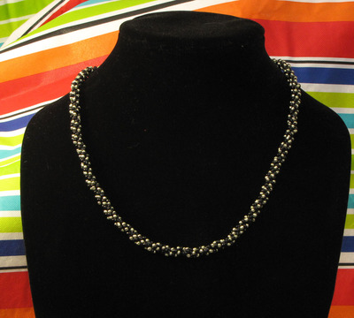 Hand woven glass beaded spiral rope - black and metallic green 