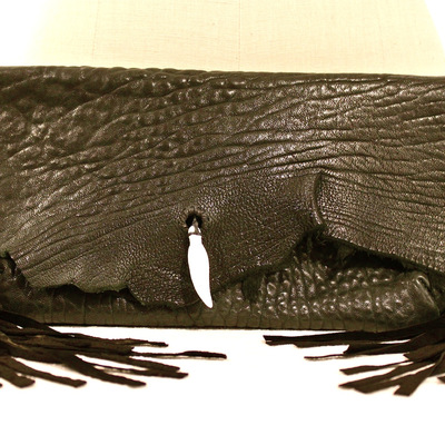 Bone feather fringe clutch