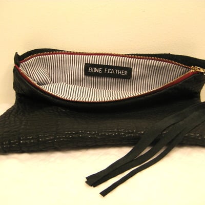 Bone feather lamb skin fold over clutch