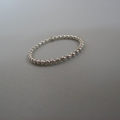 One single sterling silver beaded (dotted) band