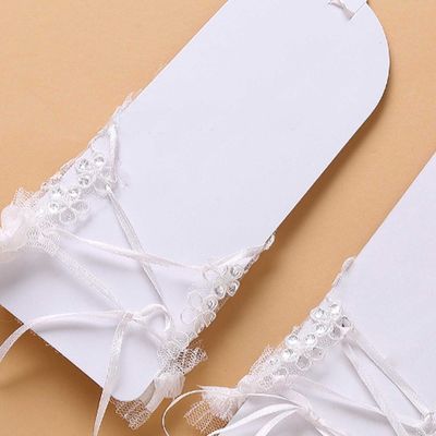 A pair of ivory embrodiery lace sequin wedding bridal short fingerless gloves
