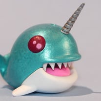 Teal Whale with red eyes