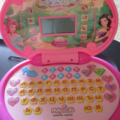 Girls princess learning russian laptop.