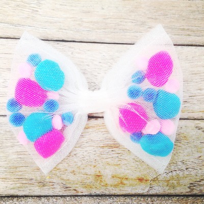 Cotton candy pom pom bow