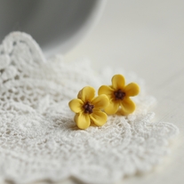 lucy. little wild flower stud earrings in romantic yellow colour
