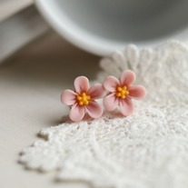 lucy. little wild flower stud earrings in romantic pink colour
