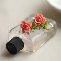 pretty single rose earrings. in coral.